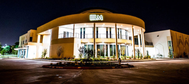 A picture of the front of IILM center at night time